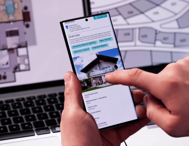 Investor reviewing a rental property listing and floor plan on a smartphone