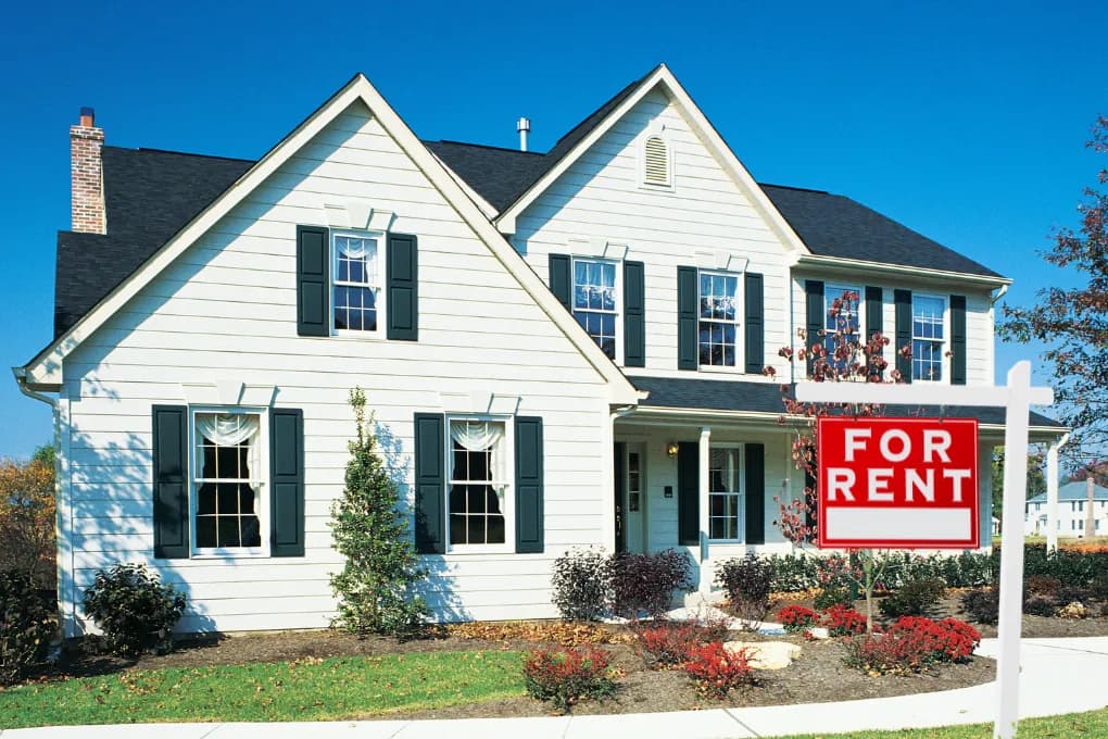 exterior image of house with for rent sign out front