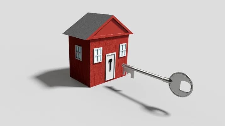 red toy house with key