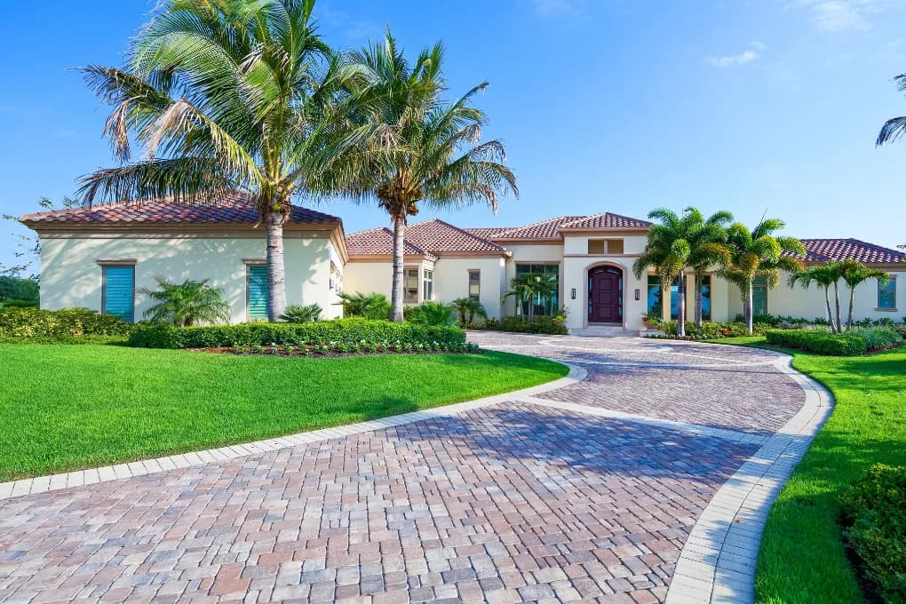 exterior image of florida home with palm trees in front