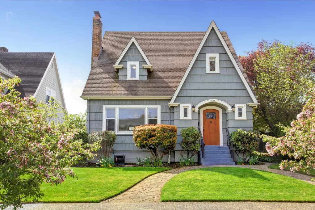 exterior image of blue house with orange door