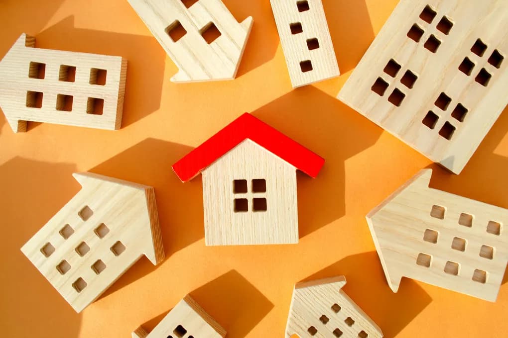 image of wooden house with red roof