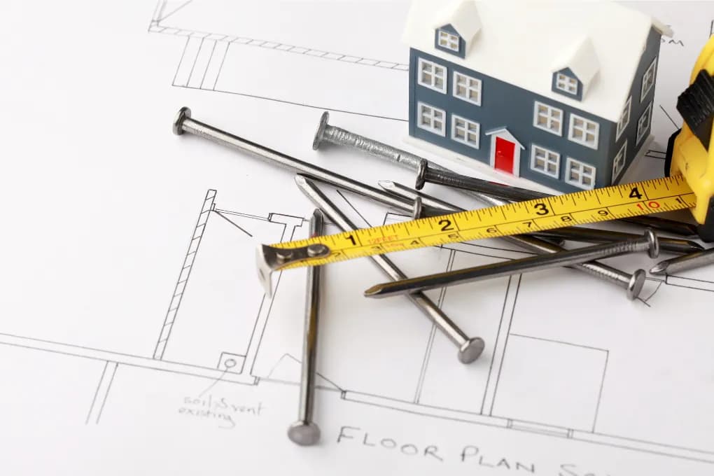 Measuring tape over architect plans